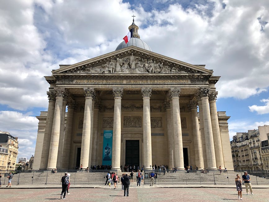 Panthéon Paris facade with people walking past the columns