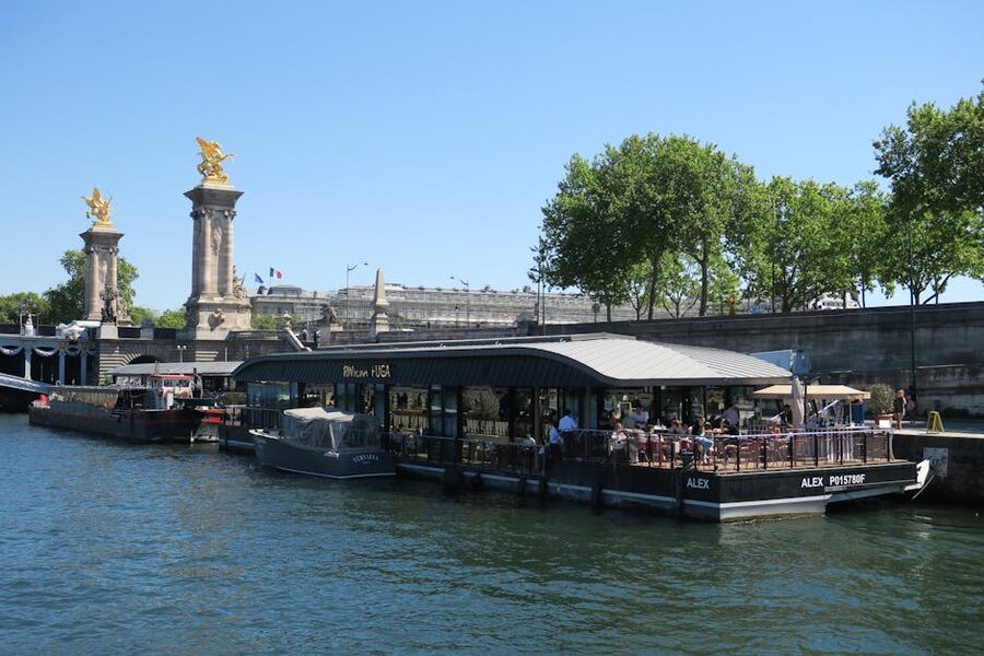 Bateaux Mouches cruise boat near Pont Alexandre III Paris on a sunny day
