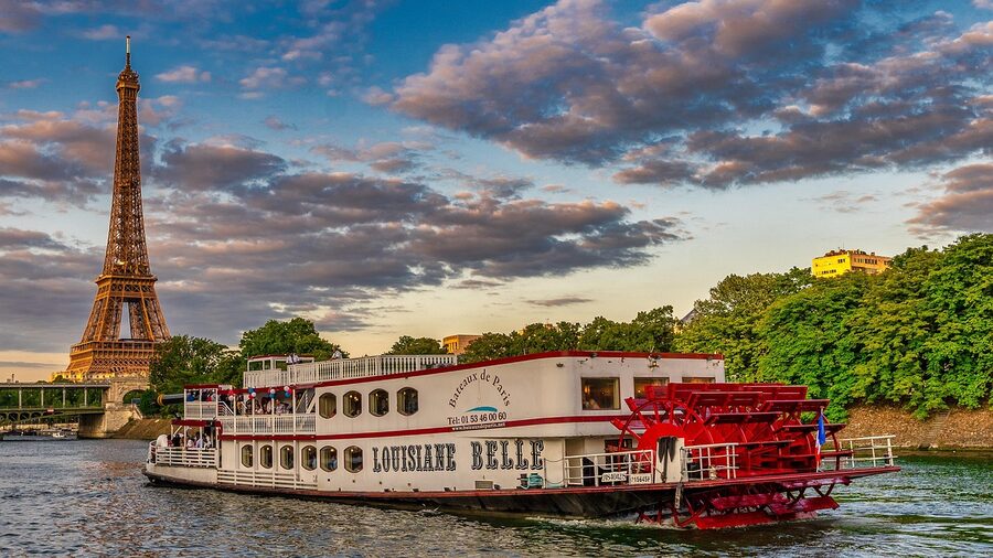 Paris Seine river cruise boat with Eiffel Tower in the background