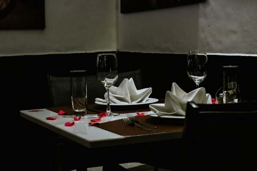 Romantic dinner table setting with wine glasses for a Paris Seine dinner cruise