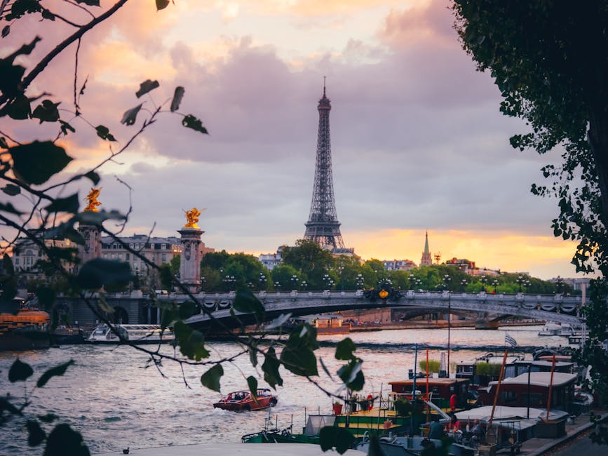 Eiffel Tower and Seine River at sunset with soft golden light