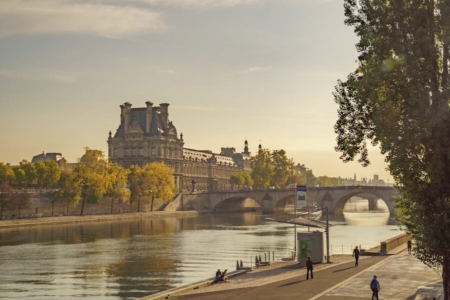 The Louvre Museum and Seine River at sunset in Paris