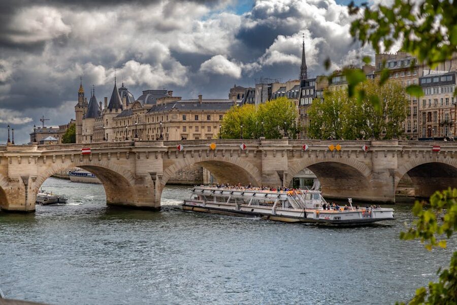 Pont Neuf and a Seine river cruise boat in Paris