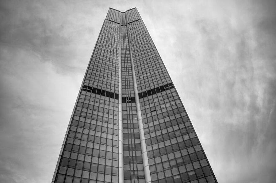 Montparnasse Tower against a cloudy Paris sky