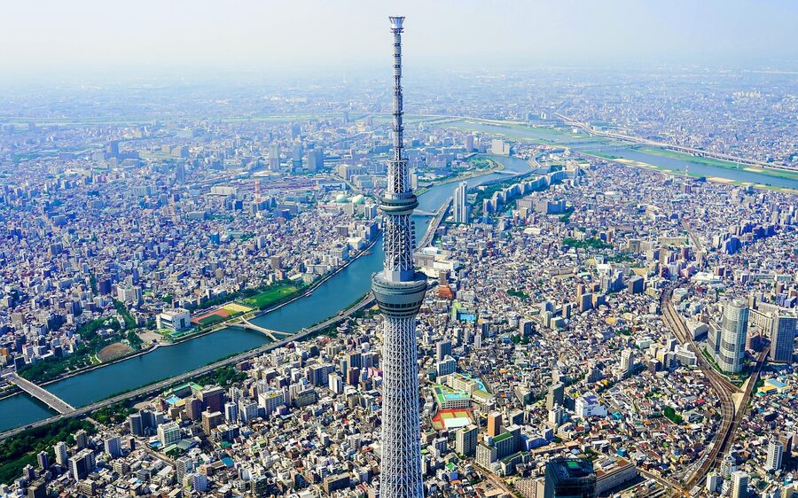 Aerial view of Tokyo Skytree tower rising above the Tokyo cityscape