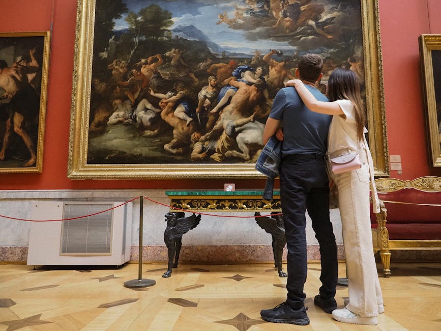 Couple admiring a classic painting in an art museum gallery