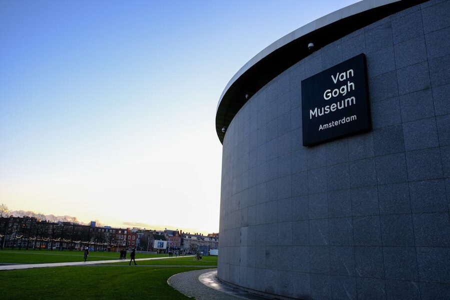 Van Gogh Museum exterior with blue sky and park, Amsterdam