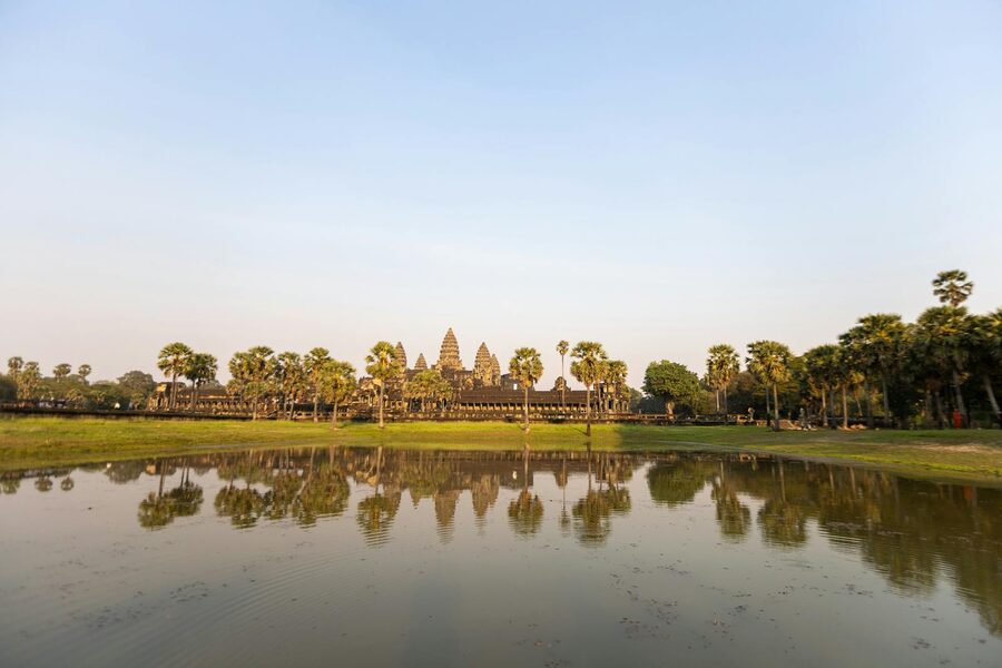 Stunning sunrise over Angkor Wat temple with reflective water