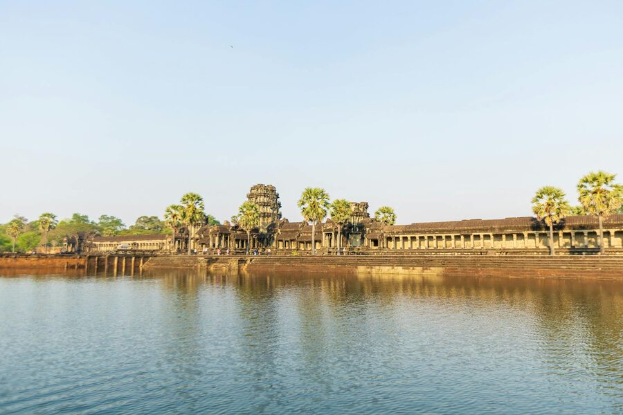 Tranquil scene of Angkor Wat with clear skies and reflection