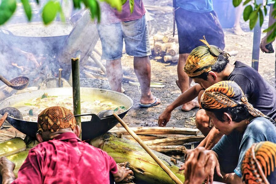 Men preparing a traditional Indonesian dish outdoors in Central Java