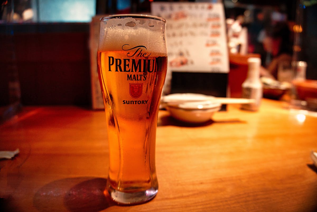 Close-up of a cold draft beer on a bar counter in Tokyo