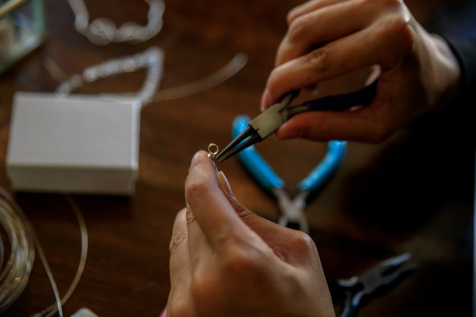 Detailed shot of handcrafting jewelry using pliers