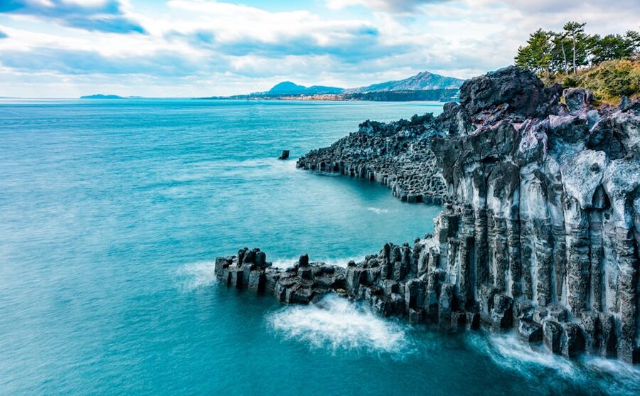 Jeju volcanic cliffs with turquoise sea