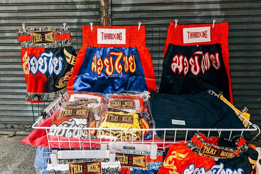 Thai boxing shorts on display in a Bangkok market