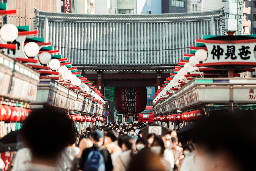 Crowd walking down Nakamise Street toward Senso-ji Temple Tokyo