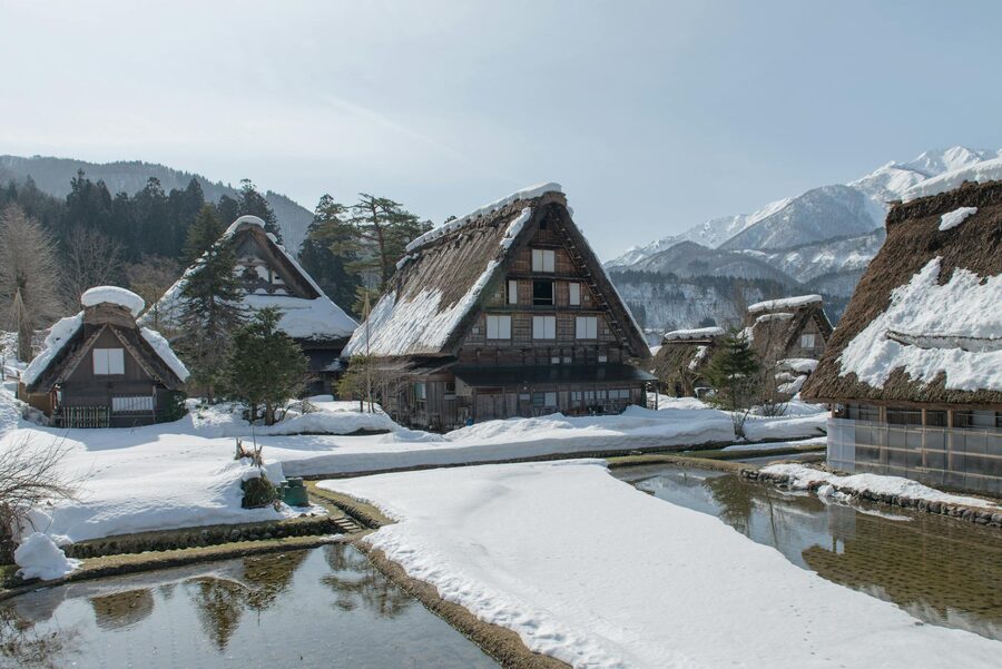 Traditional thatched-roof houses covered in snow in Shirakawa-go Japan during winter