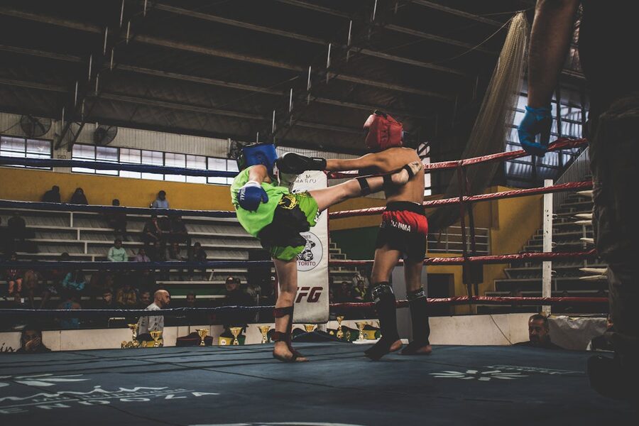 Kickboxing match inside a packed arena
