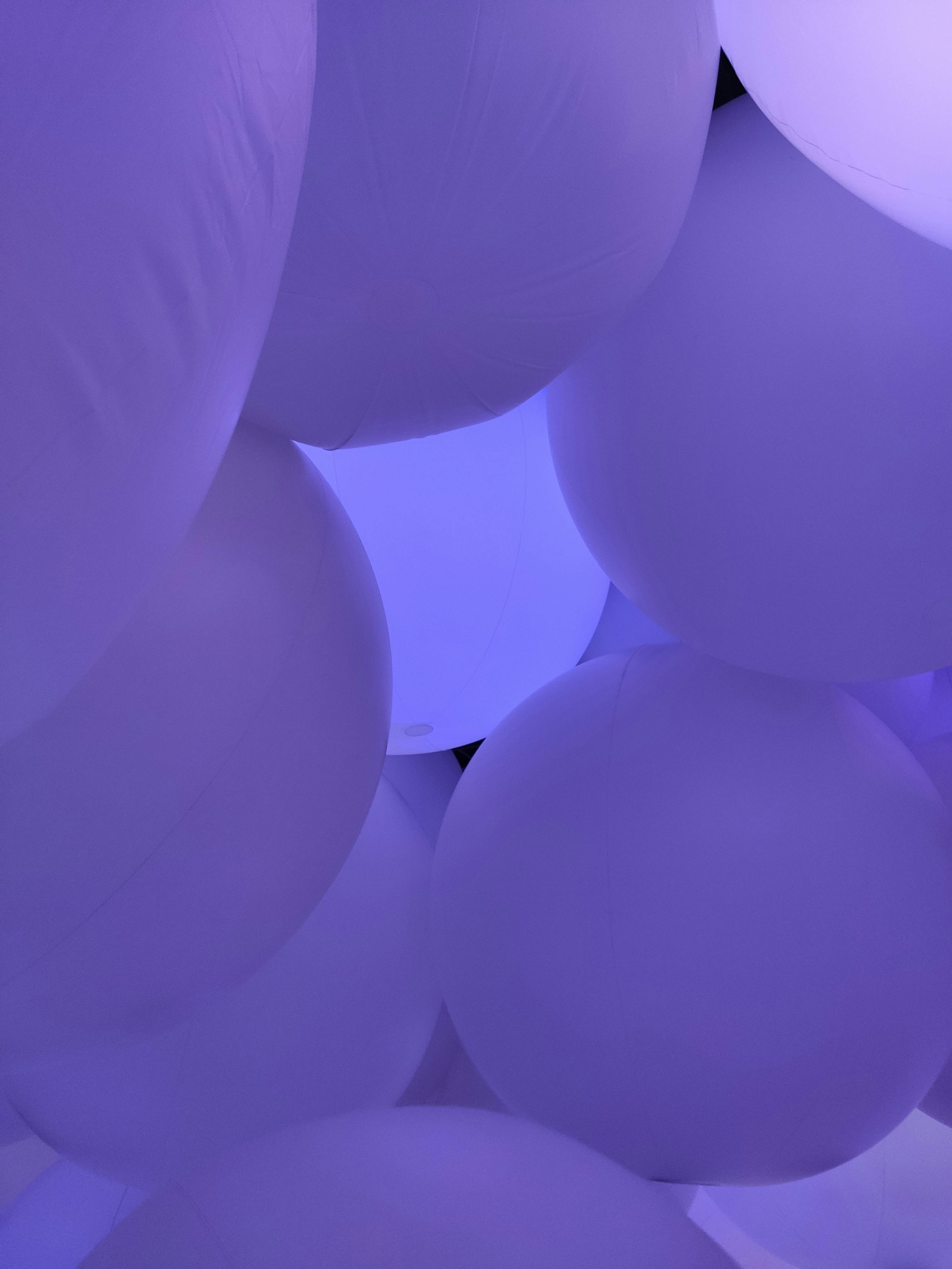 Immersive purple balloon art installation with dreamlike ambiance