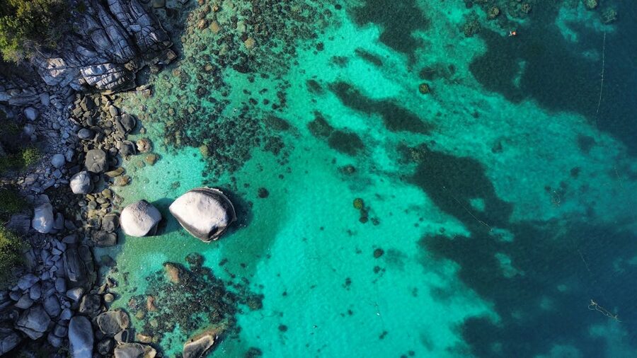 Turquoise waters and rocky shoreline at Koh Tao Thailand