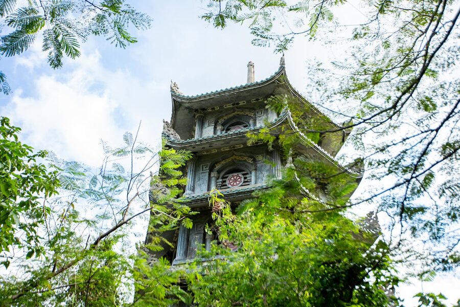 Peaceful garden with bonsai trees and pagodas at Da Nang temple