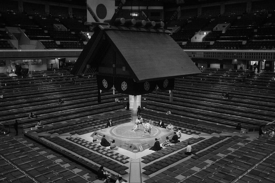 Black and white photo of a sumo wrestling match in Tokyo Japan