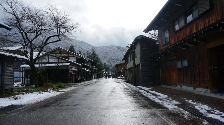 Traditional houses in Shirakawa-go village with snow-covered roofs during winter in Gifu Japan