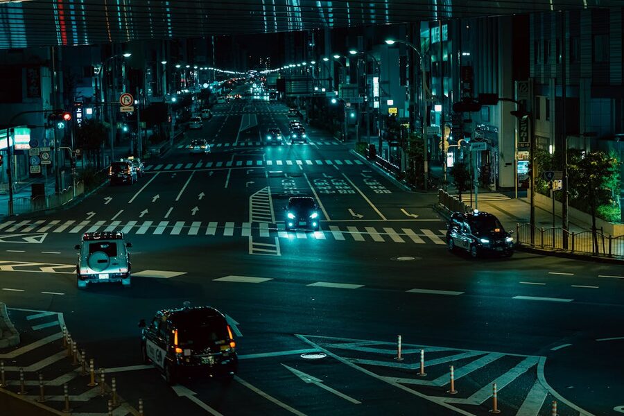Nighttime Tokyo street scene with bright city lights