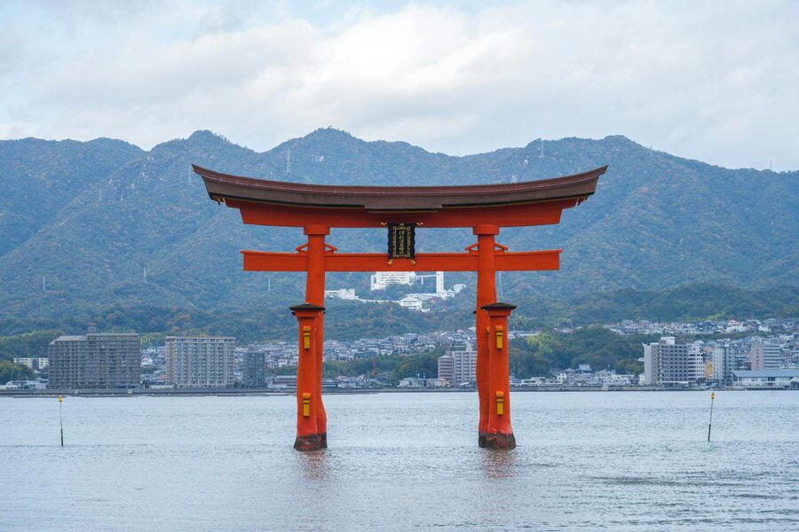 The iconic floating torii gate of Itsukushima Shrine standing in the water at Miyajima