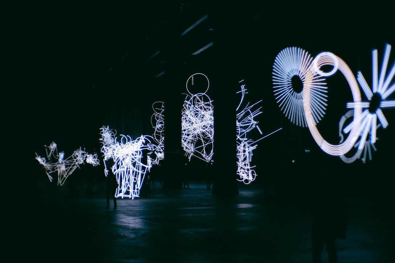 Artificial light figures representing circles and beams with tangled patterns