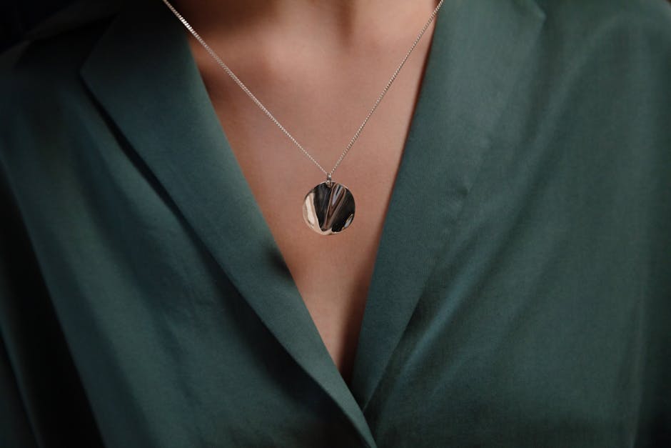 Close-up of a stylish silver necklace with a pendant