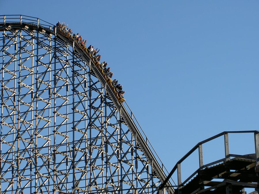 Roller coaster ascending the lift hill before the first drop