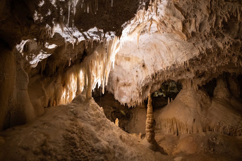 Atmospheric cave interior with natural light filtering through an opening