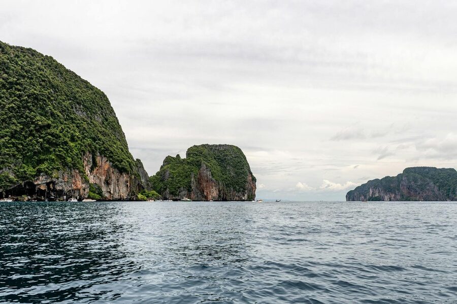 Limestone cliffs rising from the serene Andaman Sea near Phi Phi Islands
