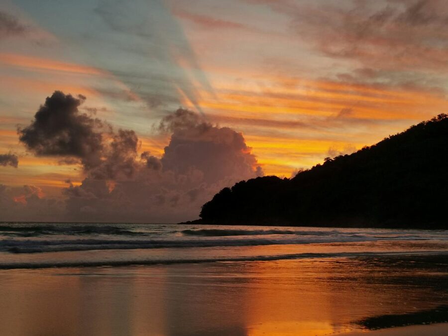Golden sunset over a tranquil beach in Phuket Thailand