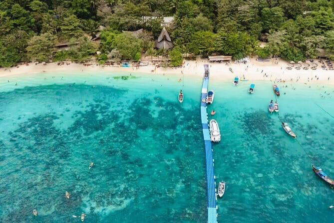 Phuket: Coral, Racha, Promthep Island Catamaran Day Trip - Coral Island: Sun, Sand, and Water Sports