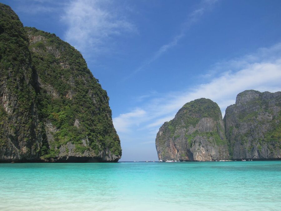 Towering limestone cliffs rising from deep blue water near Phi Phi Islands