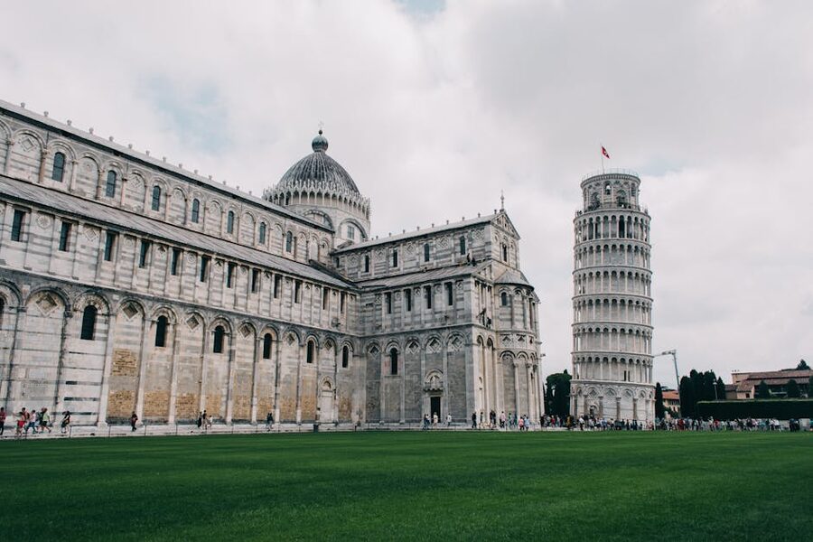 Leaning Tower of Pisa with tourists in Piazza dei Miracoli