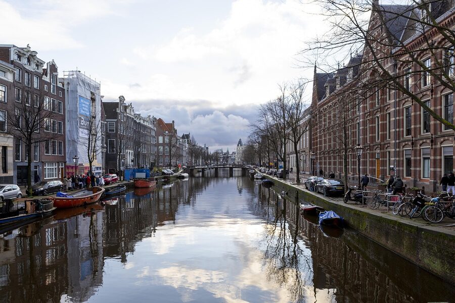 Amsterdam canal on a winter evening with reflections