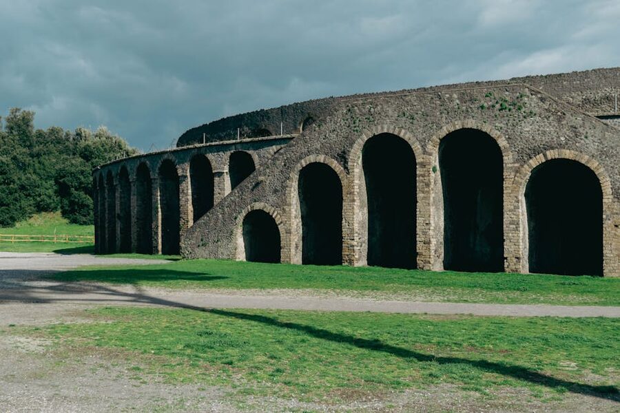 Sunlit Pompeii amphitheater interior on a clear day