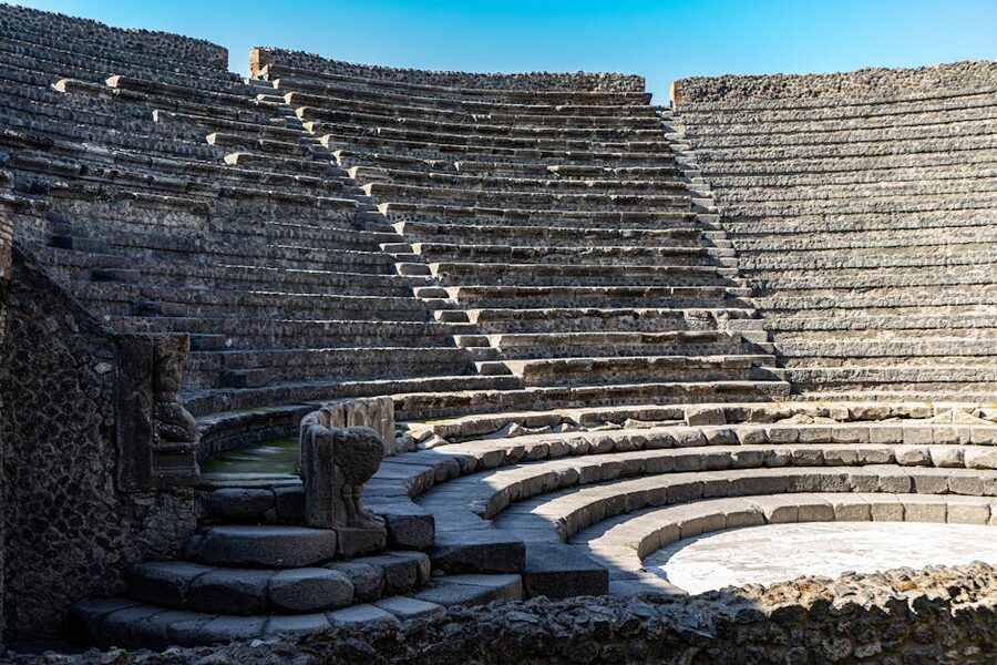 Ancient Roman amphitheatre at Pompeii showing tiered stone seating