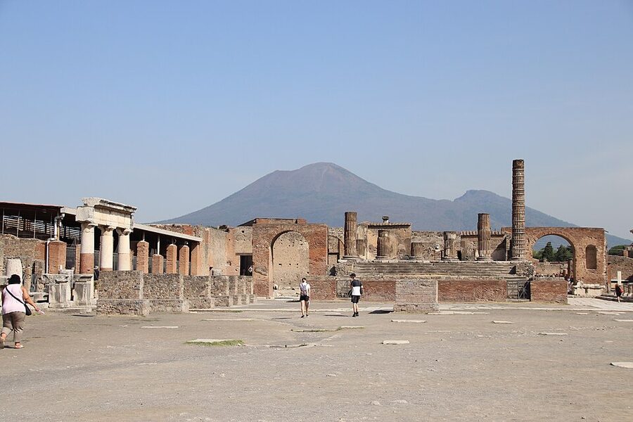 Pompeii Forum with Mount Vesuvius rising behind the ancient Roman ruins