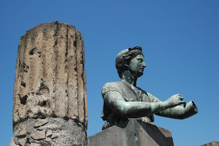 Ancient Roman fresco on a Pompeii ruin wall showing original colour pigment