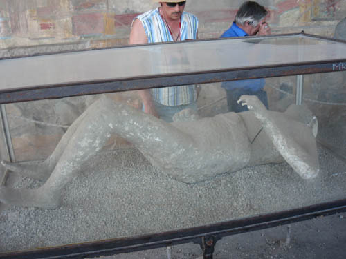 Plaster casts of victims of Mount Vesuvius eruption displayed at the Macellum in Pompeii