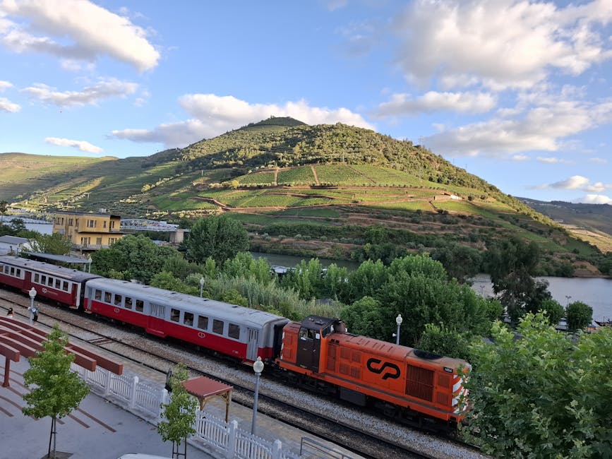 Train in the Douro Valley running along the river