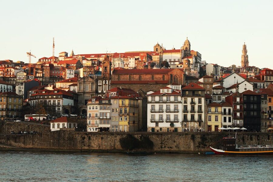 Cais da Ribeira waterfront Porto cruise departure point with colorful buildings