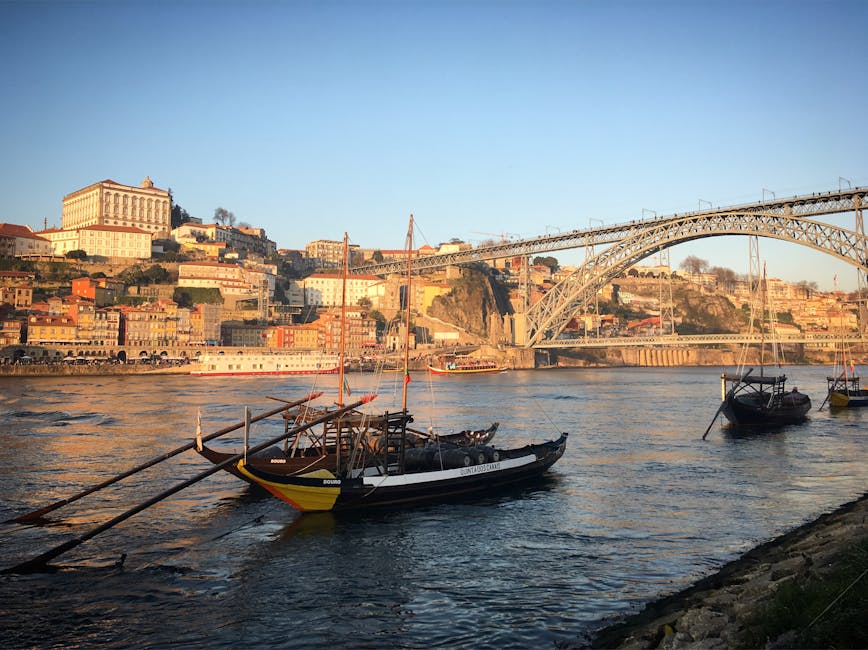 Rabelo boats on the Douro River with Dom Luis I Bridge in background