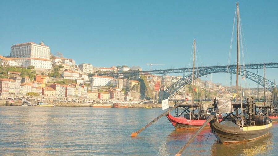 Porto Ribeira waterfront with traditional boats and colorful tile buildings