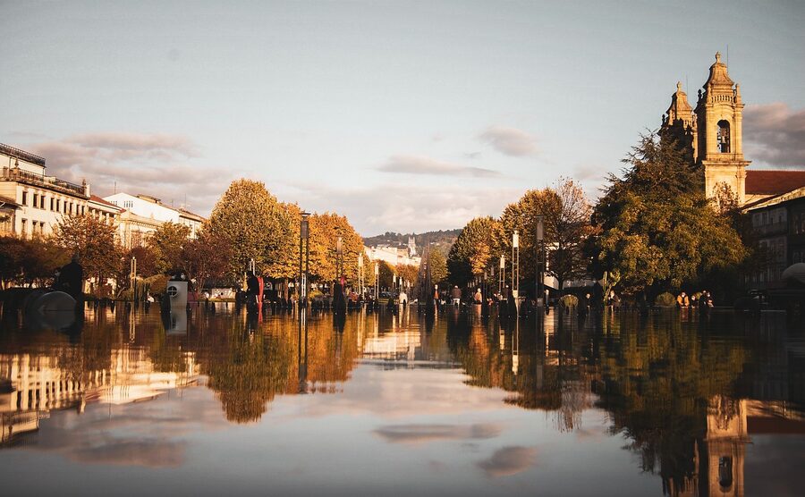 Braga cathedral reflection in water at sunset