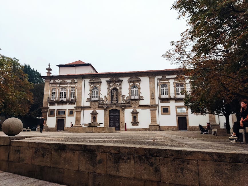 Historic building in Guimaraes with autumn foliage