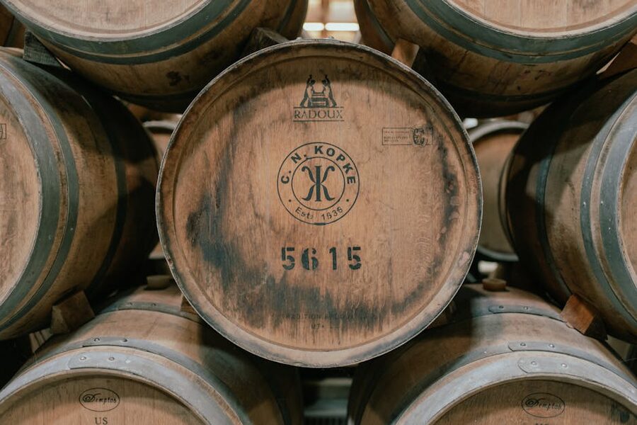 Wooden wine barrels aging in a Porto cellar
